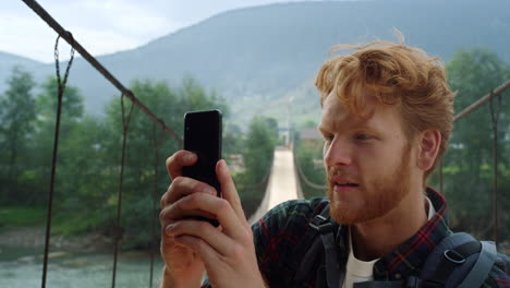 tourist hipster taking video mobile phone close up. traveler make nature photo