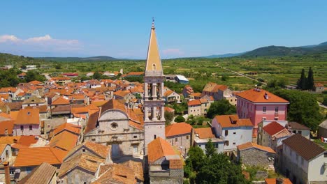 coastal town, red-roofed houses and a bell tower