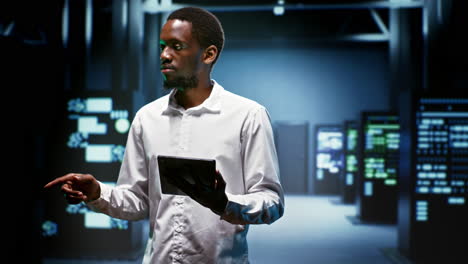 technician doing checkup in server room