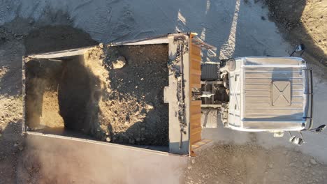 truck unloads sands