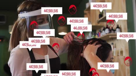 animación de iconos de coronavirus sobre una peluquera caucásica y una mujer con máscaras faciales