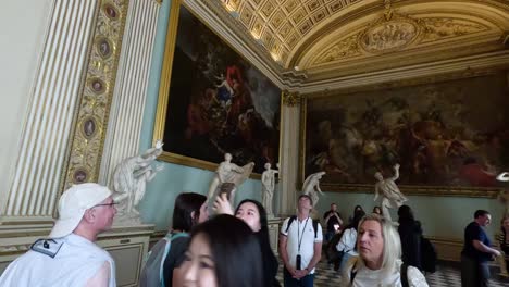 visitors admire sculptures and paintings in florence