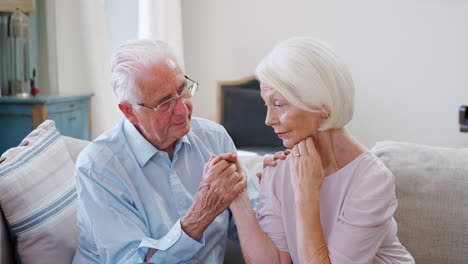 Senior-Man-Comforting-Woman-With-Depression-At-Home