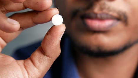 person holding a pill