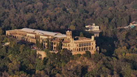 orbit shot of historical chapultepec castle in heart of green forest in mexico city