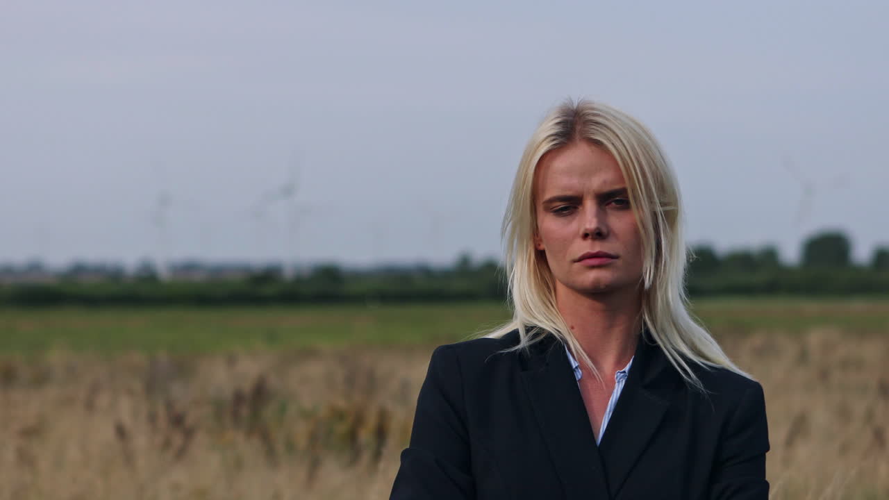 A boss lady having time alone outside to reflect on the present way to her company success. Professional lady worried about her future career. Businesswoman in a suit reflecting on the company profit