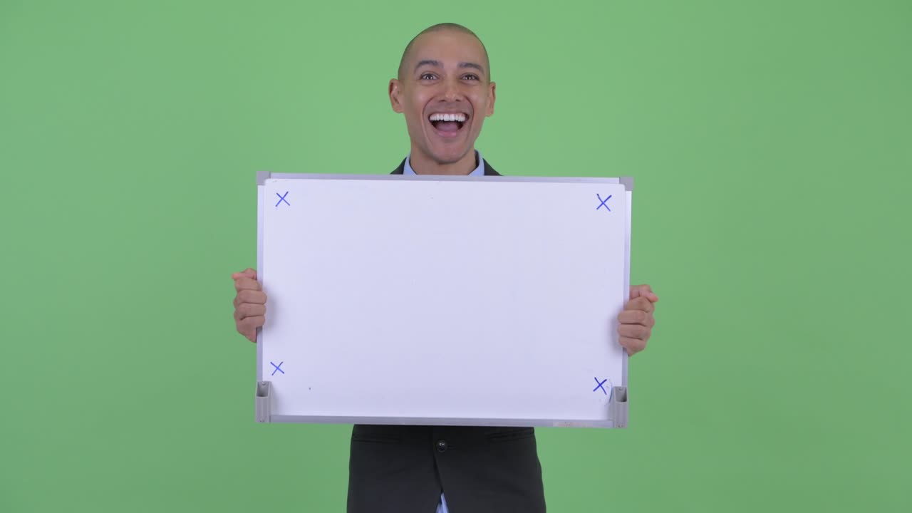 Happy handsome bald multi ethnic businessman with whiteboard