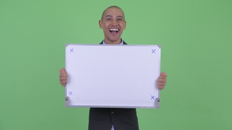 happy handsome bald multi ethnic businessman with whiteboard