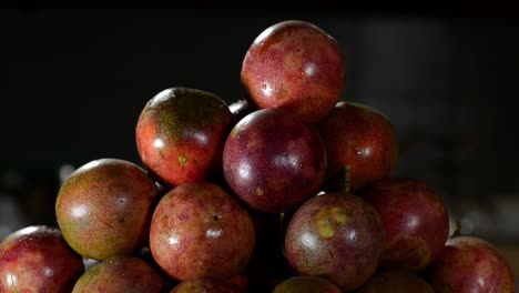 tiltt up shot of many passion fruits in focus on table,close up in studio