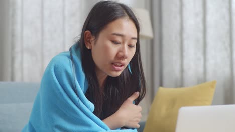 woman taking medicine at home