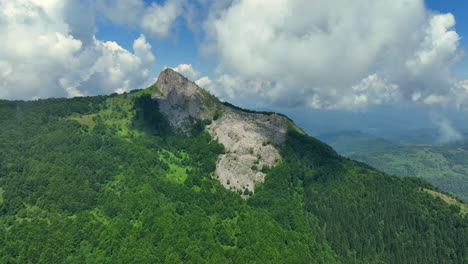 flight over green mountain peaks