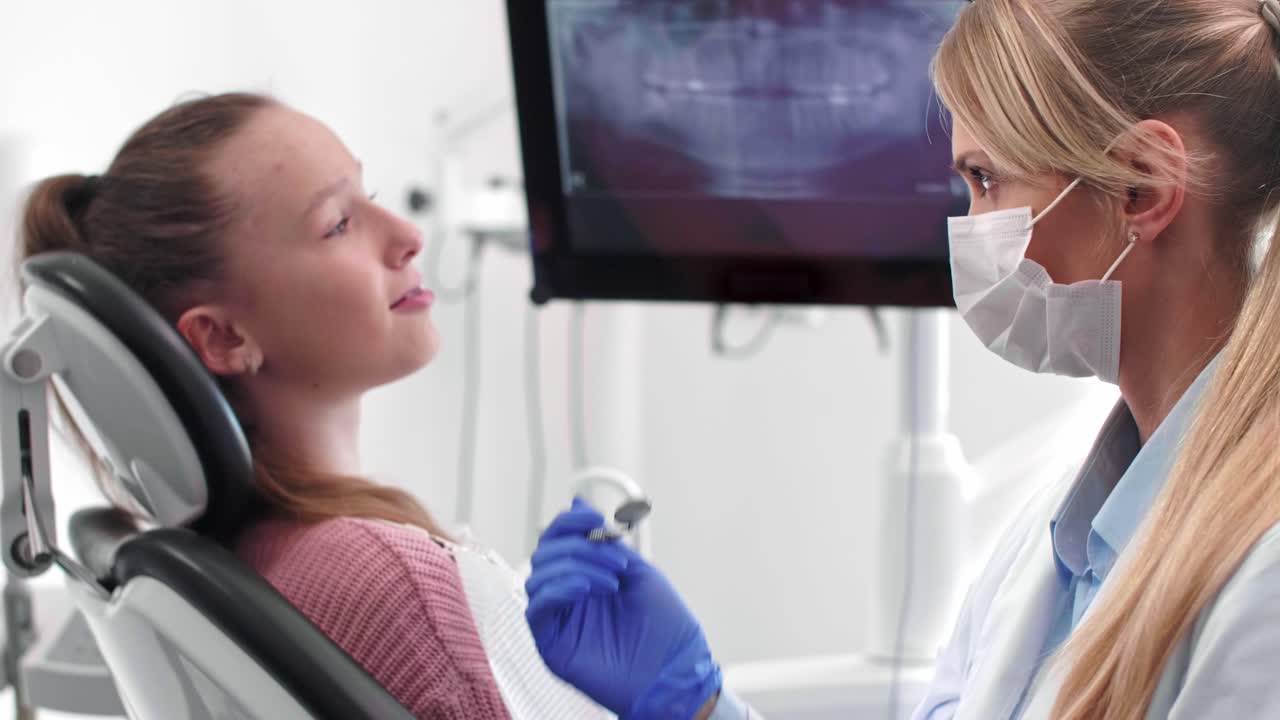Portrait of smiling dentist doing her work in dentist's clinic