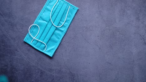 blue face masks on dark background