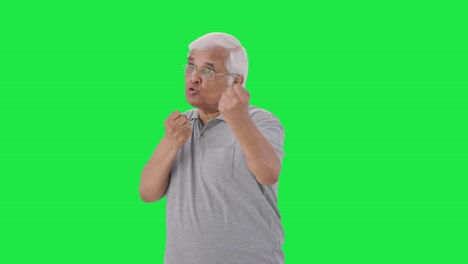 Angry-Indian-old-man-fighting-with-someone-Green-screen