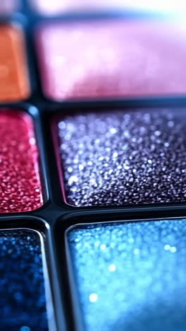 shimmery colorful eyeshadow palette. close-up of a vibrant eyeshadow palette showcasing various shimmering shades in an artistic arrangement.
