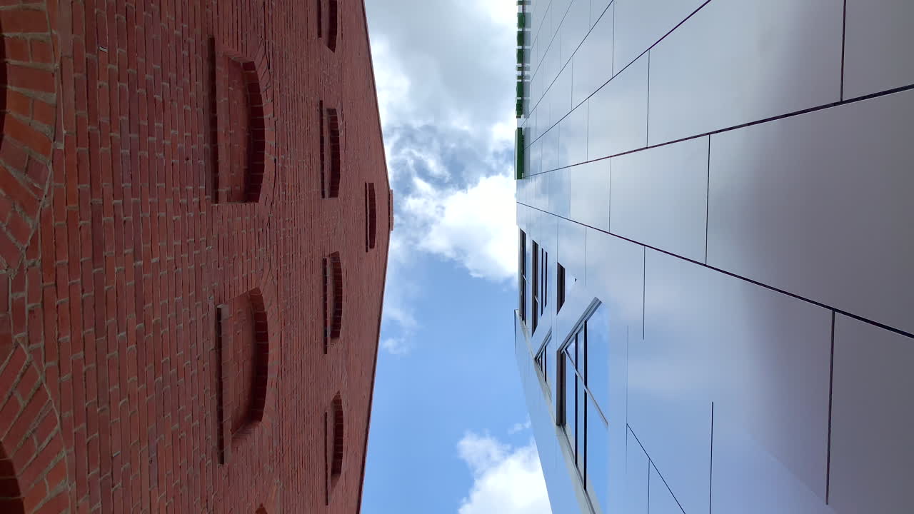 Old Brick Building vs. Modern Glass Building