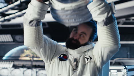 portrait of joyous astronaut holding helmet performing routine maintenance
