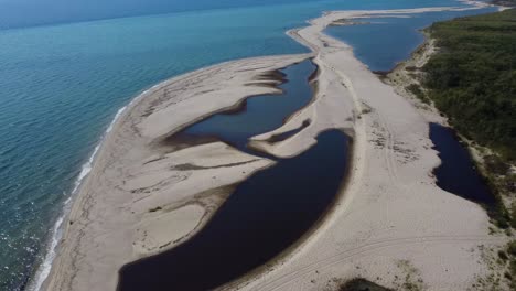 aerial view over river estuary and coastline, nestos river delta, greece