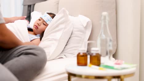 a father tends to his sick child in bed, ensuring comfort and care in a warm, softly lit room