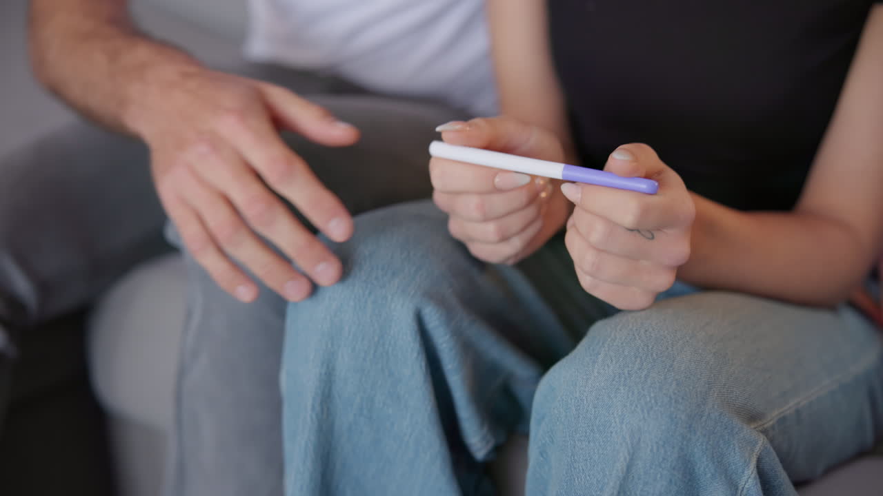 Closeup, hands and a couple with pregnancy test