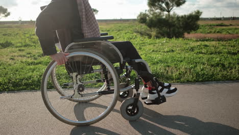 person in wheelchair at park