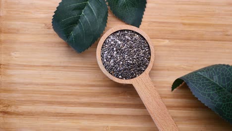 top view of chia seed in a wooden spoon