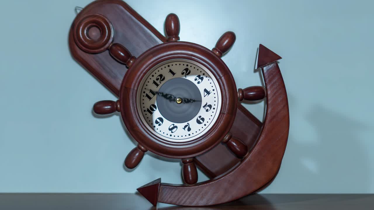 Timelapse of the clock in the shape of an anchor and a ship's helm