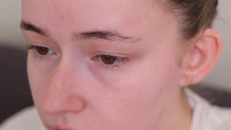 close-up portrait of a sad teenager girl
