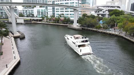 luxury megayacht navigates its way back to its harbor on the miami river in downtown miami, florida
