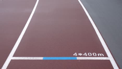 athletics track in the stadium. the ground marks 4*400m.