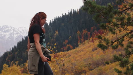 woman hiking in colorful autumn mountains