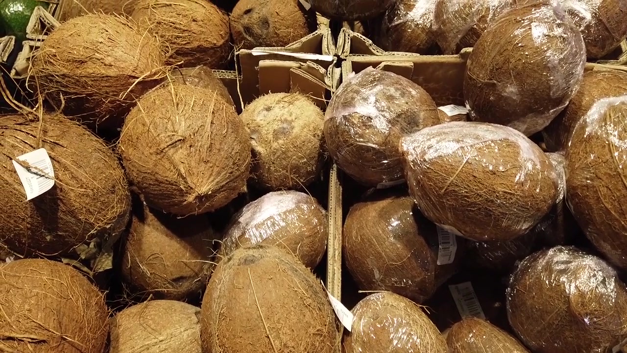 Coconuts in shop. Shooting with conducting.