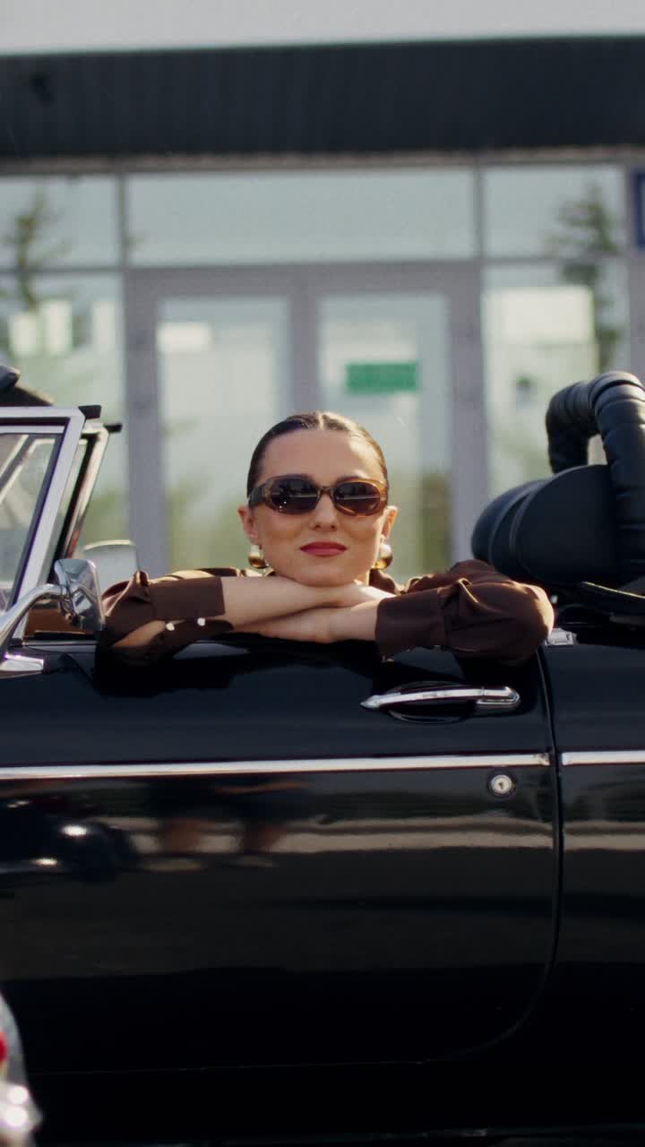 Woman in a vintage convertible