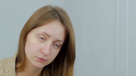 beautiful young woman applies concealer foundation cream make up