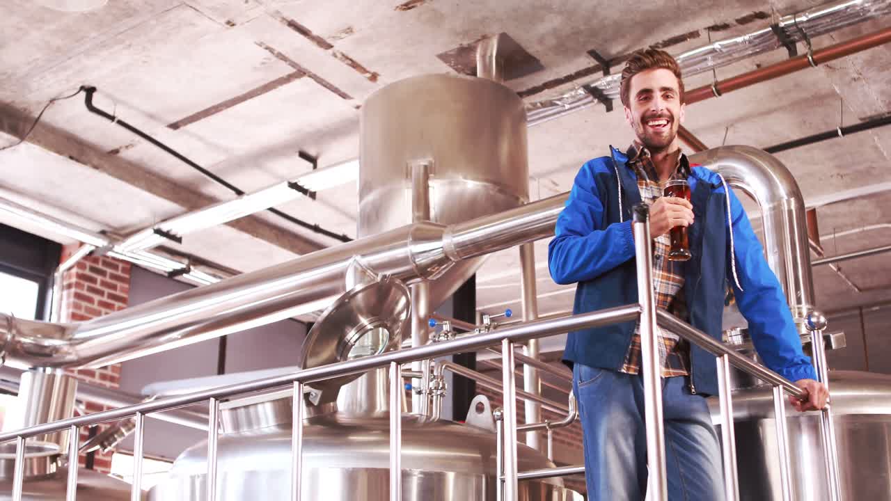 Brewery worker checking the product