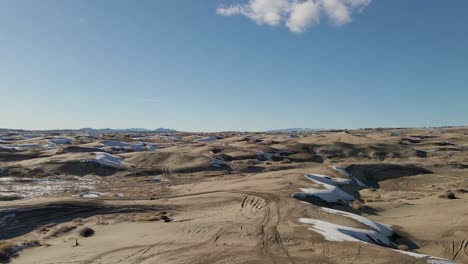 beautiful aerial view of desert sand dunes in utah in winter