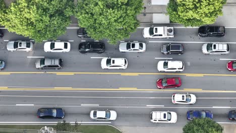 Overhead-view-of-urban-city-busy-street-lane,-Buckhead-Street,-Atlanta,-Georgia,-USA