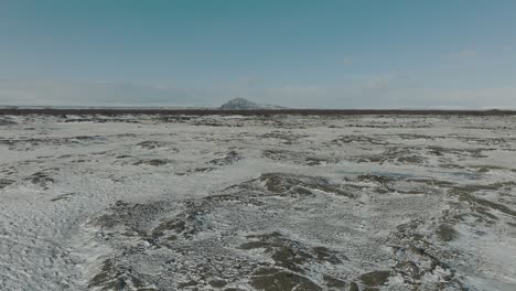 icy rocks of a cold wintry countryside in desolate iceland - aerial