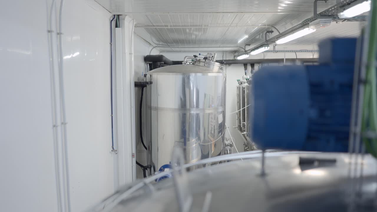 Modern Brewery Interior with Stainless Steel Tanks and Equipment