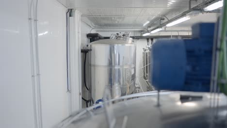 modern brewery interior with stainless steel tanks and equipment