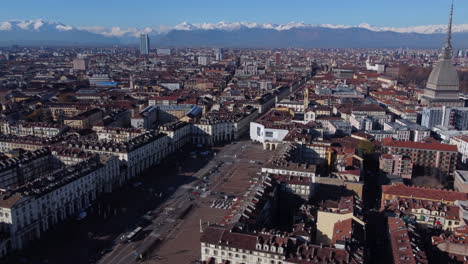 aerial pan left shot over turin revealing mole antonelliana dome, italy
