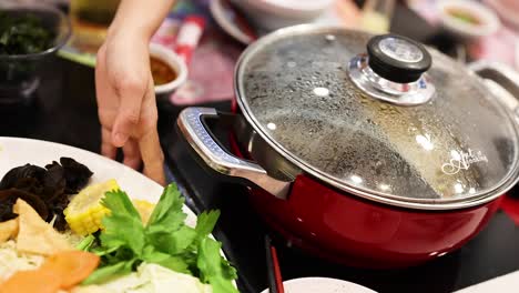 cooking and sharing a hotpot meal together