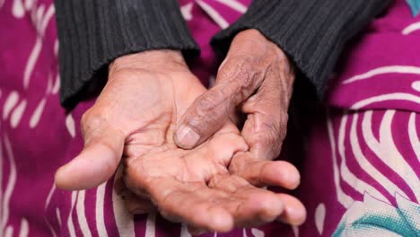 Elderly-woman-suffering-from-pain-sitting-on-sofa