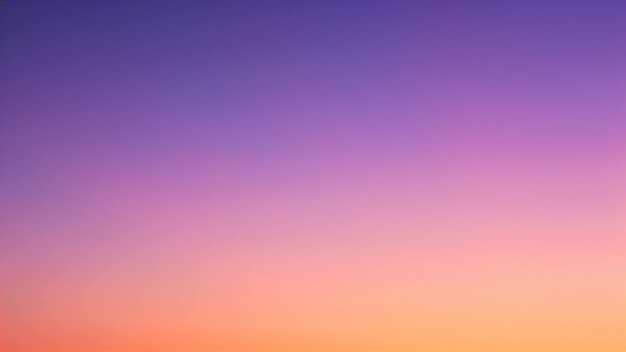 Shifting sky gradient showing warmer pink-lavender and orange hues at sunrise, sun nearing horizon