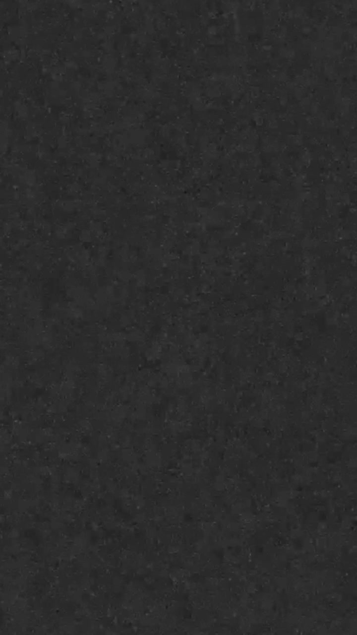 Dark Textured Background with Subtle Grain and Abstract Surface