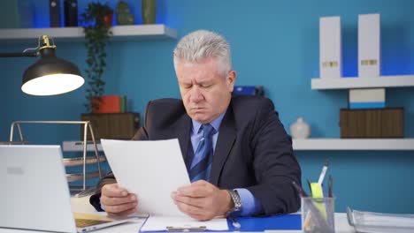 Businessman-upset-with-negative-paperwork-results.