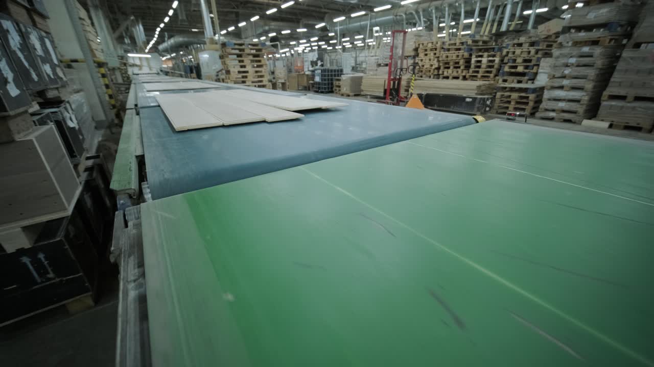 Wooden Floorboards Moving on a Conveyor Belt in a Modern Factory
