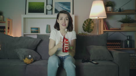 woman watching a disappointing sports game