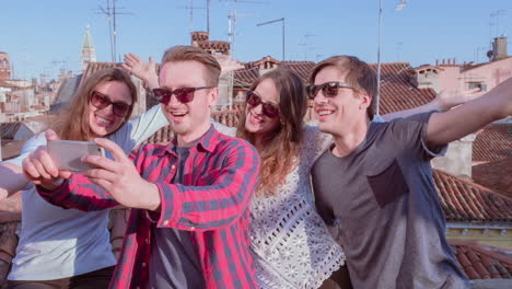 friends taking selfie on rooftop in venice