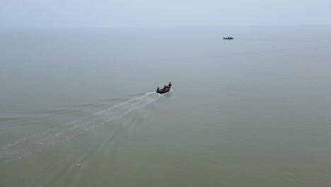 aerial view of fishing trawler boats in indian ocean on the bangladesh coast going for fishing